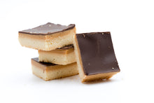 Load image into Gallery viewer, four millionaire shortbreads stcked ontop of eachother on a white background.
